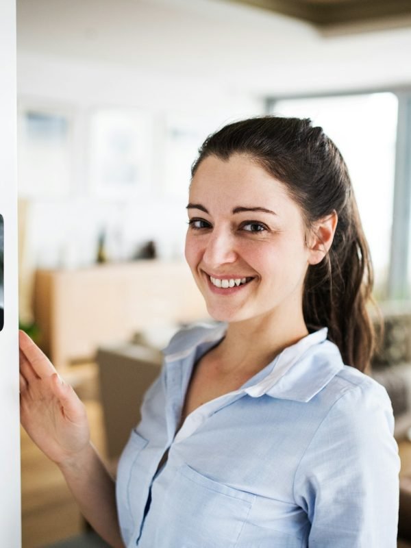 a-woman-looking-at-tablet-with-smart-home-screen-.jpg